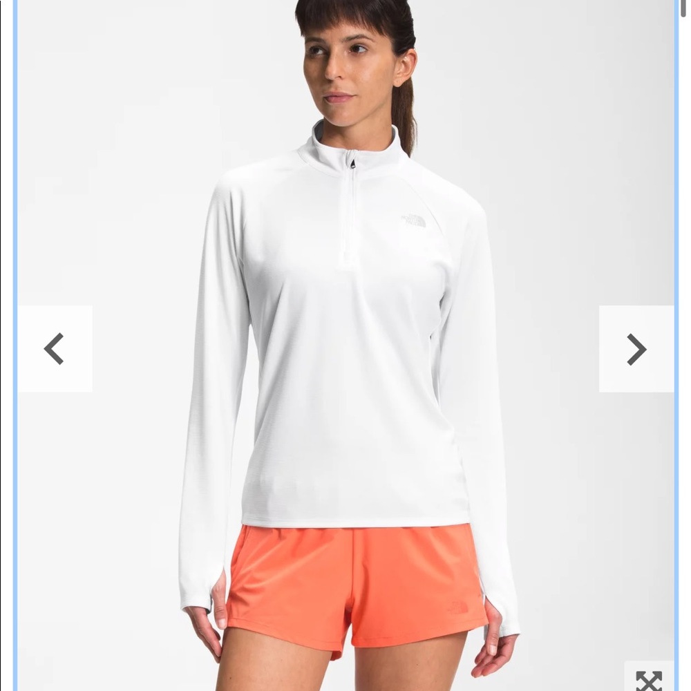 The North Face 1/4 zip up active wear top.